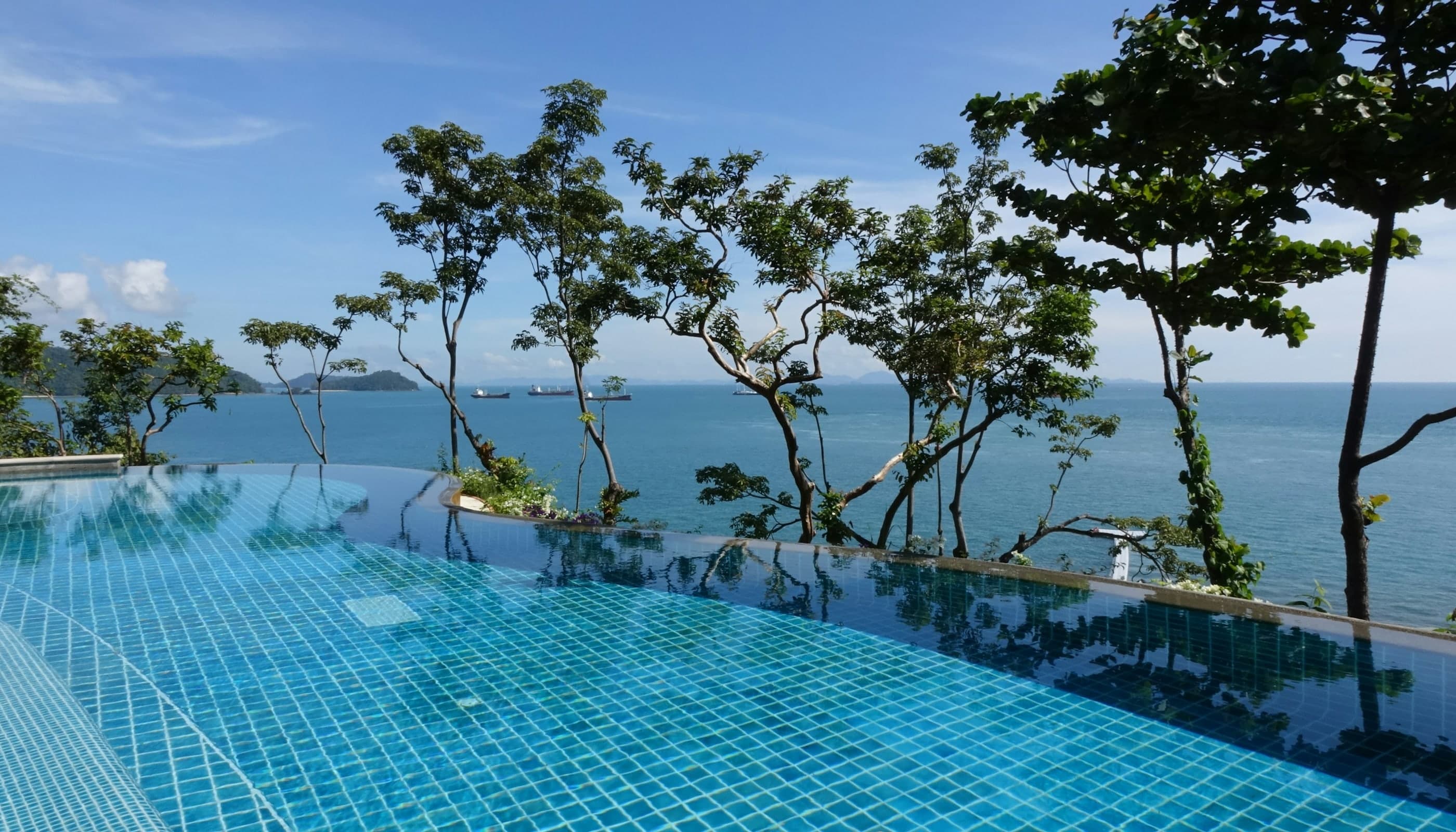 Luxury Thailand infinity pool villa terrace overlooking the ocean