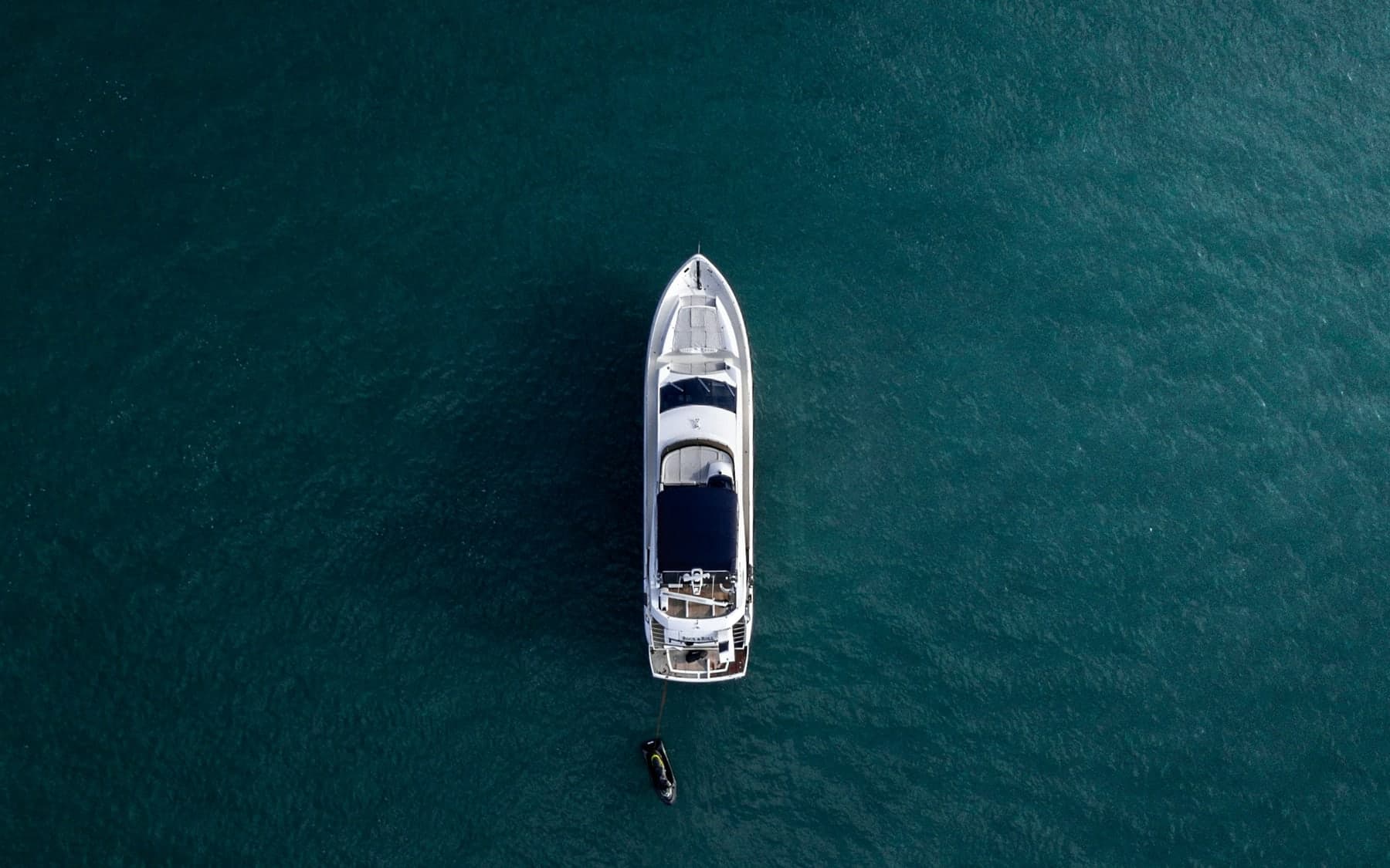 Private yacht beside limestone islands in Thailand