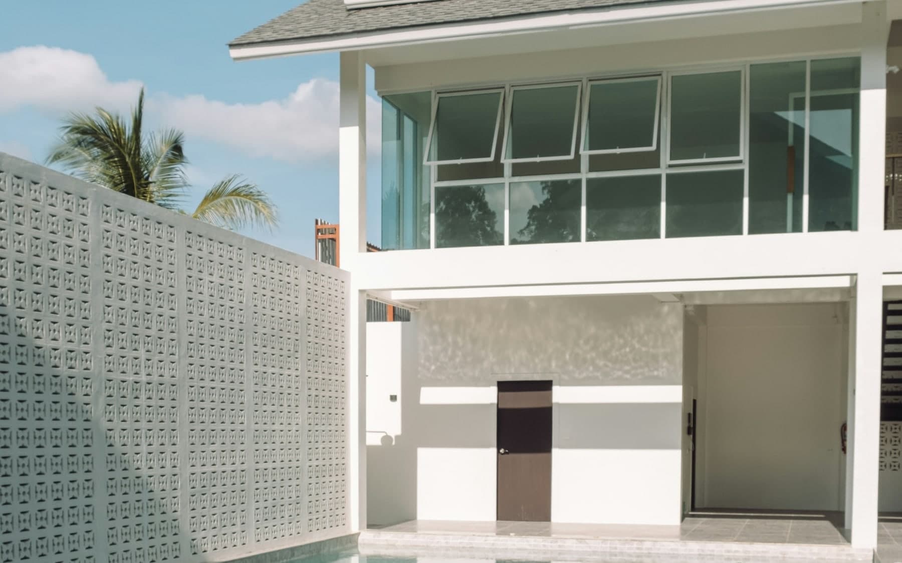Luxury Thailand villa viewing with architectural plans and ocean view